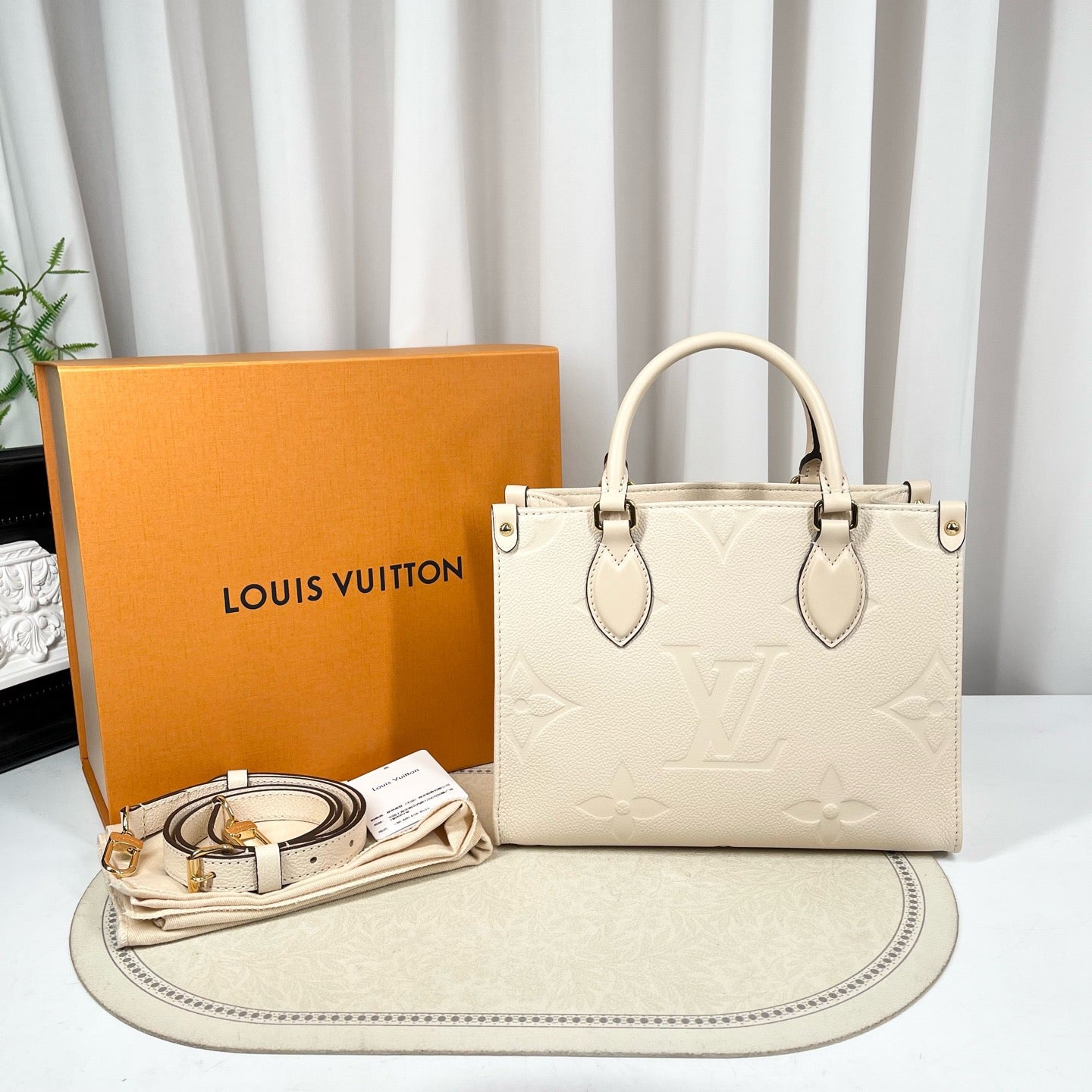 Louis Vuitton Onthego PM Cream Monogram Empreinte Tote Bag