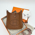 Hermès Mini Evelyne Crossbody Bag in Gold Brown