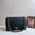 Chanel Maxi Classic Flap Bag in Black Lambskin with Silver
